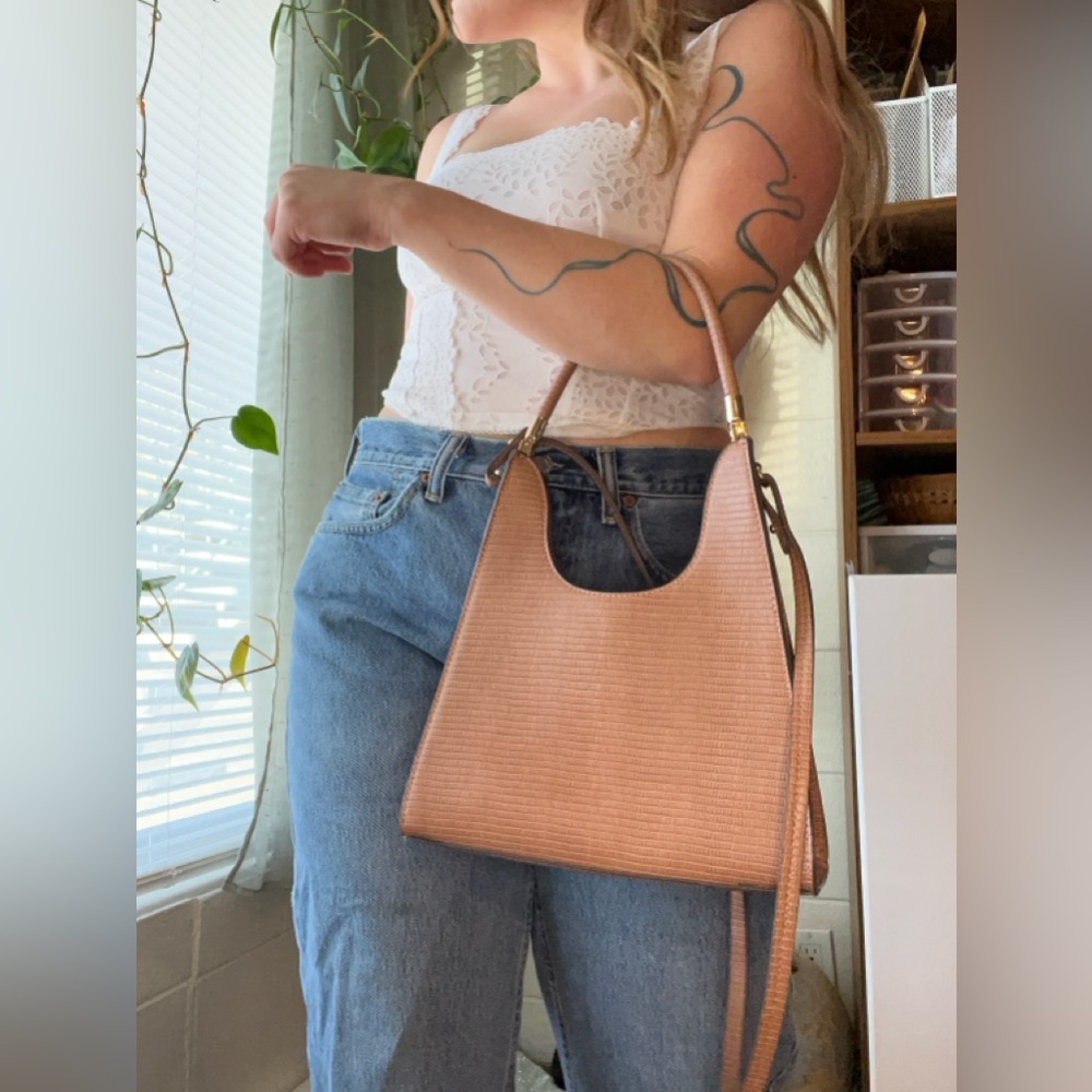 Brown purse with removable straps.